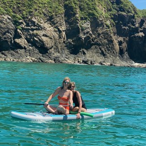 a man riding a surfboard on top of a mountain