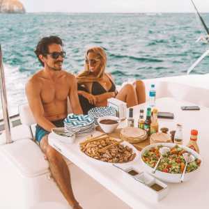 a group of people sitting at a beach
