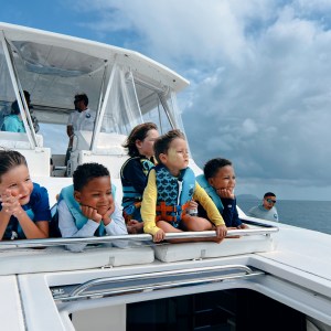 a group of people on a boat in the water
