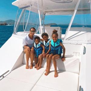 a group of people in a boat on a body of water